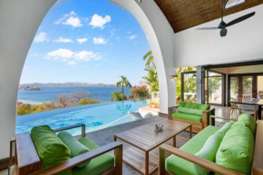 Ocean-View Flamingo Palace with Stone Courtyard and Giant Infinity Pool